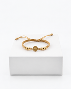 Pulsera San Benito con seis balines diamantados N.º 5 y cordón beige