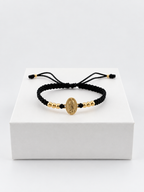 Pulsera Virgen de Guadalupe con seis balines lisos N.º 4 y cordón negro